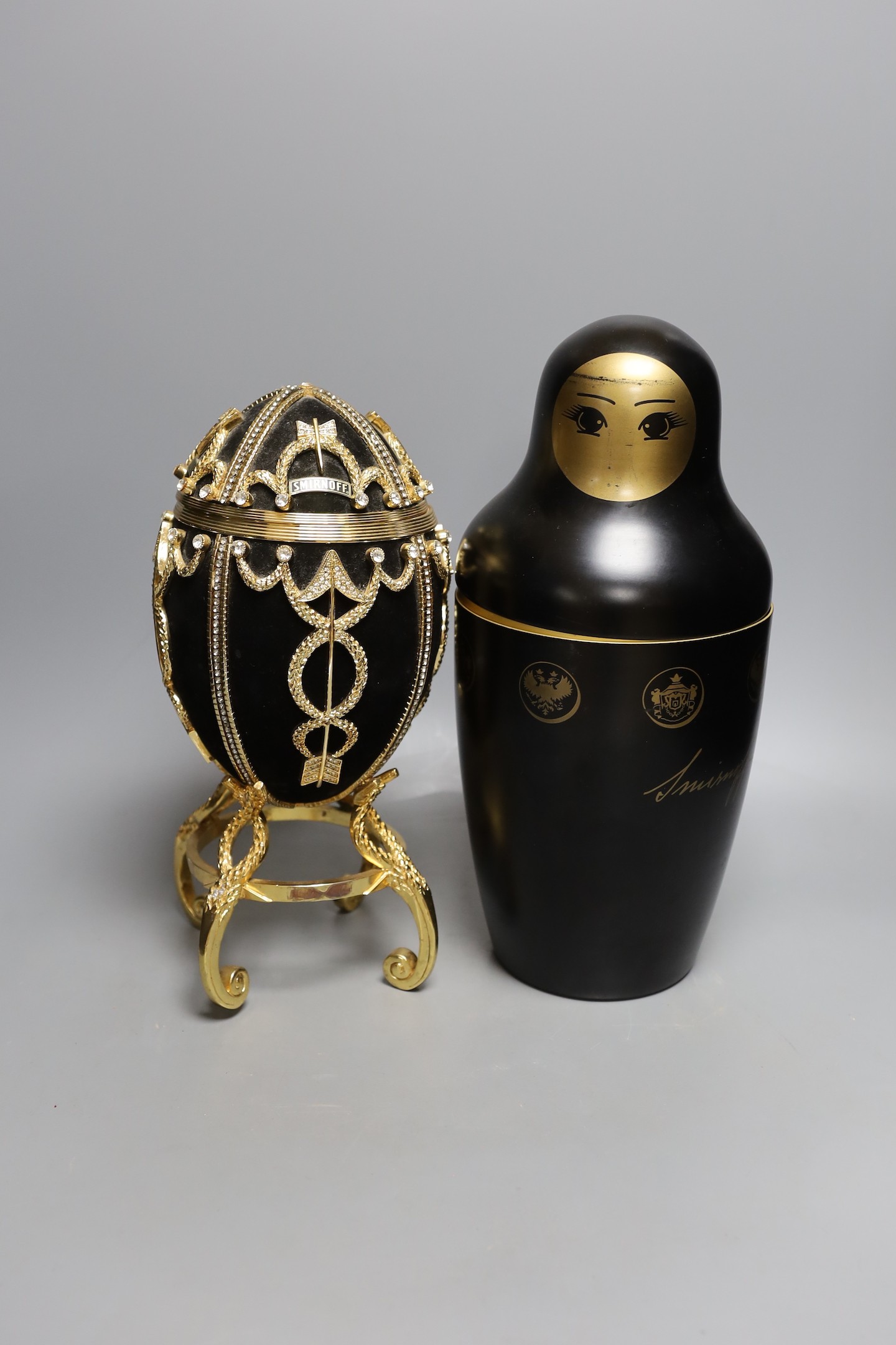 An advertising Smirnoff Russian doll metal bottle holder and an egg shaped and diamanté ice bucket, egg ice bucket 33cms high.